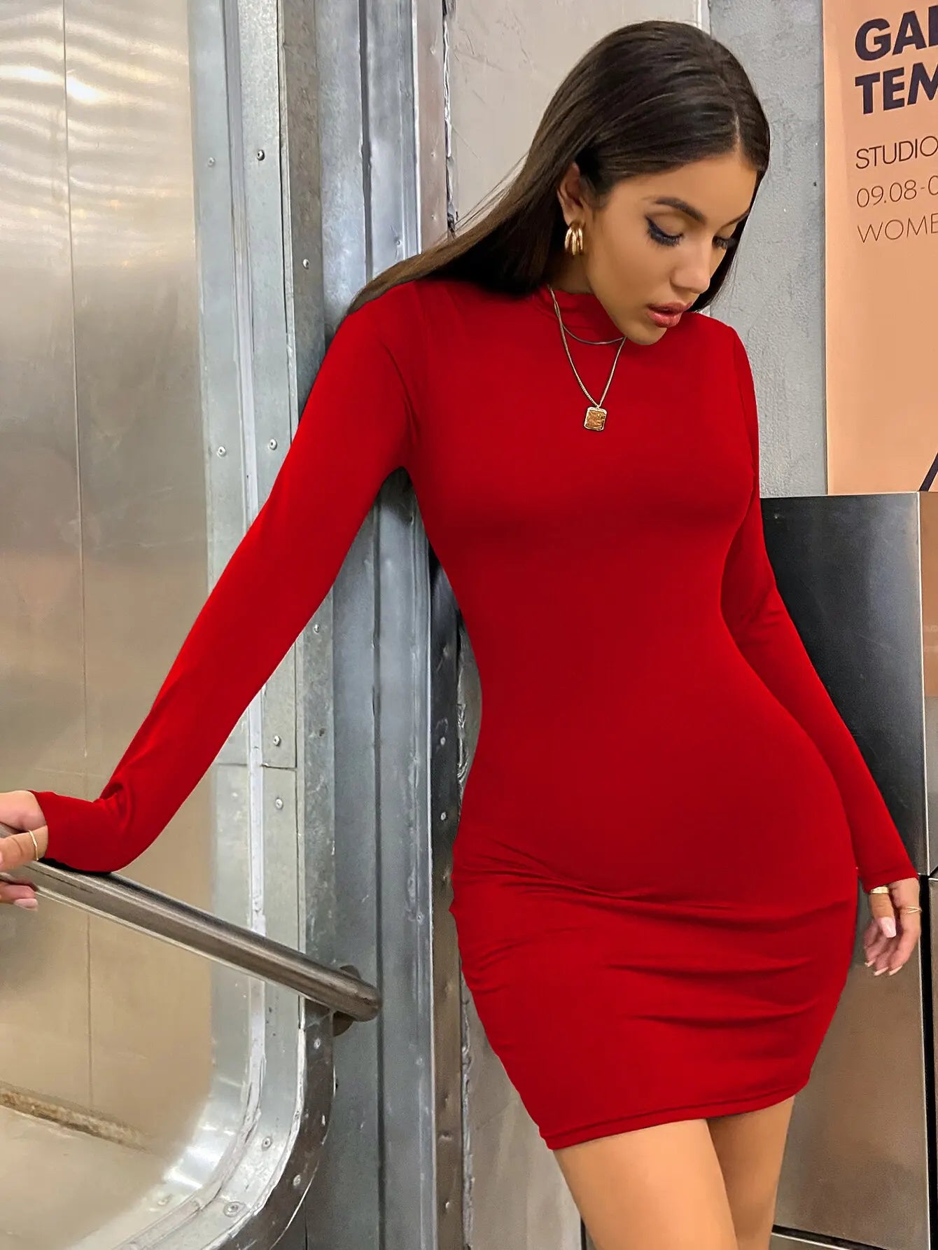Women's short dress with long sleeves and a high neck.