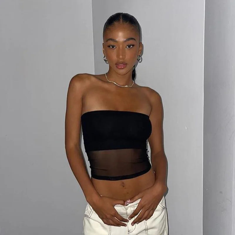 Black knit cropped top with patchwork details.
