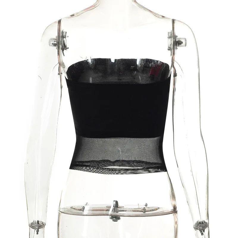Black knit cropped top with patchwork details.