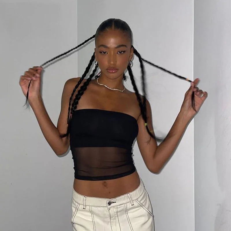 Black knit cropped top with patchwork details.